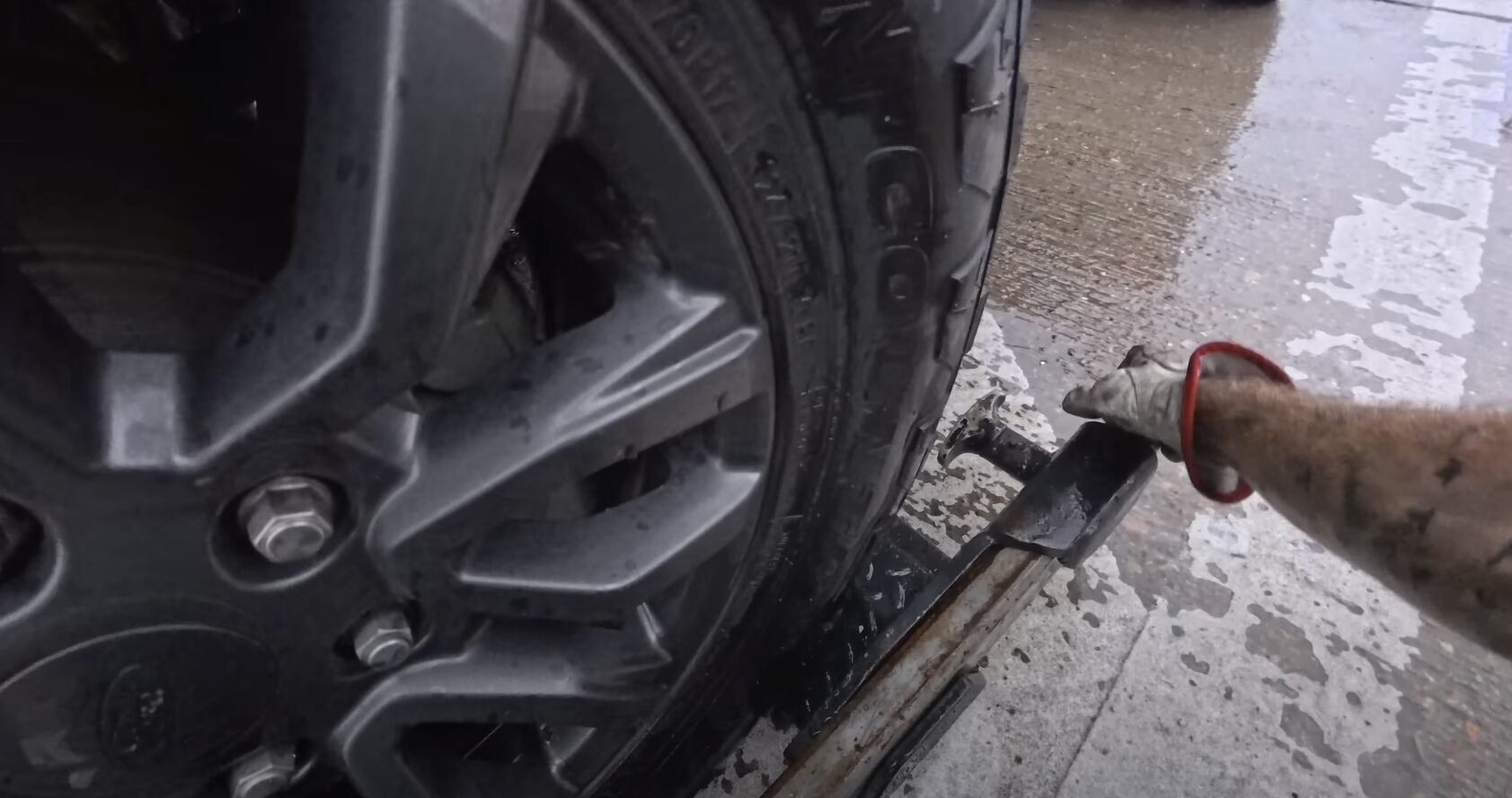 Highway Breakdown Safety - Edina Towing Service Response Close-up of vehicle wheel and towing equipment during breakdown